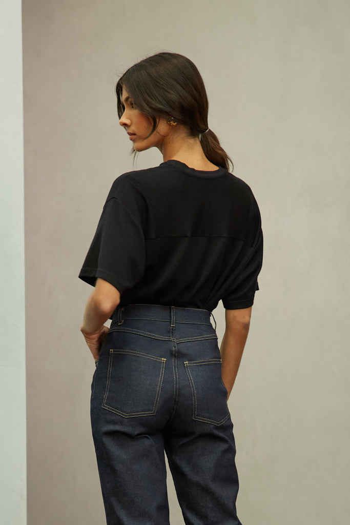 Black Zoey Tee This tee crafted from premium merino wool features an oversized relaxed silhouette and a lightly sheer finish.Style with The Sarah Stretch Jean