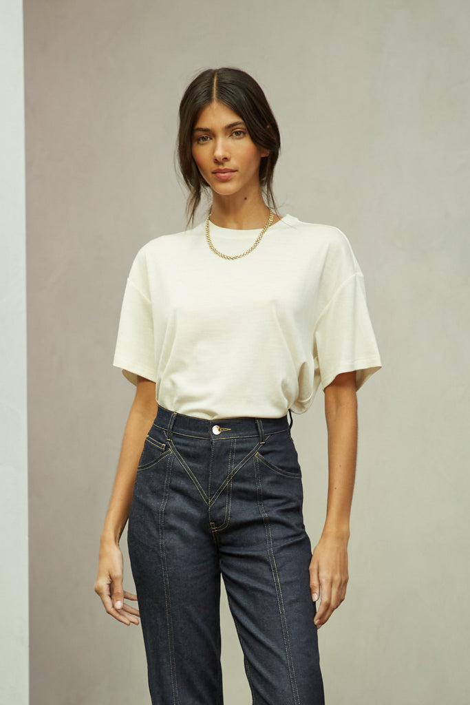 Bone Zoey Tee This tee crafted from premium merino wool features an oversized relaxed silhouette and a lightly sheer finish.Style with The Sarah Stretch Jean