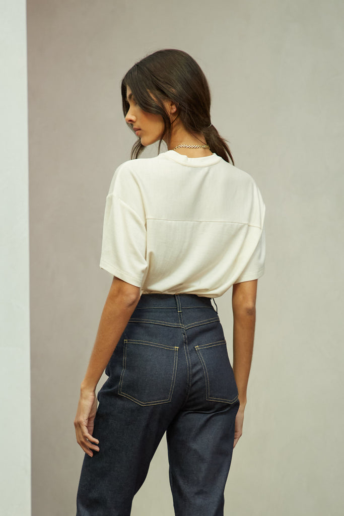 Bone Zoey Tee This tee crafted from premium merino wool features an oversized relaxed silhouette and a lightly sheer finish.Style with The Sarah Stretch Jean