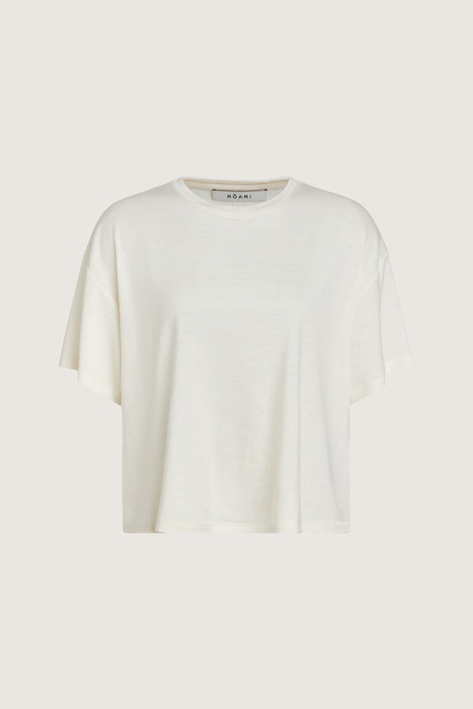 Bone Zoey Tee This tee crafted from premium merino wool features an oversized relaxed silhouette and a lightly sheer finish.Style with The Sarah Stretch Jean