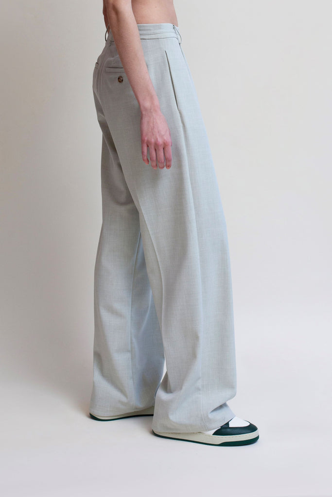Sage Kat Trouser Dual pleated mid-rise trousers featuring a straight, relaxed fit. Pockets at back with horn buttons. Includes a self-fabric detachable belt. *Sale merchandise is exchangeable for size or store credit. 